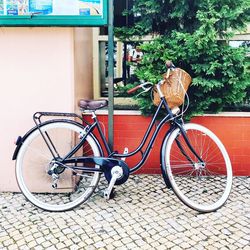 Bicycle parked against wall