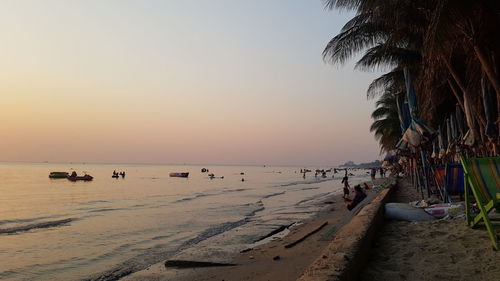 Scenic view of beach against sky during sunset