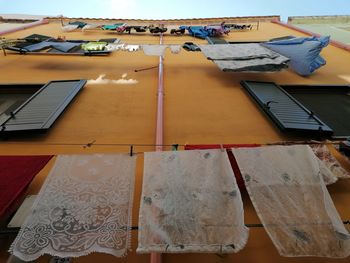 Low angle view of clothes drying on building