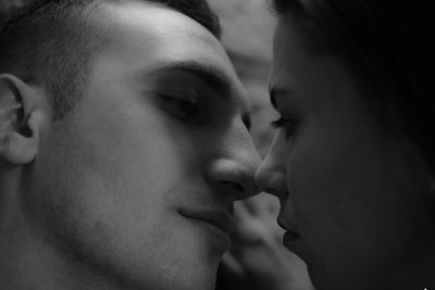 Close-up of couple kissing at home