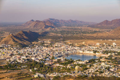 Aerial view of town against sky