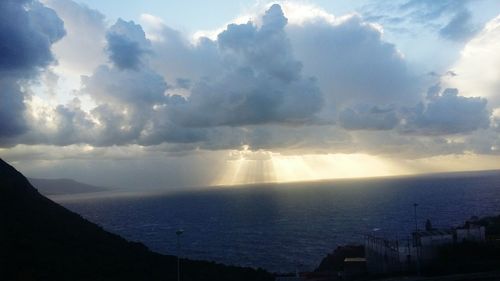 Scenic view of sea against cloudy sky