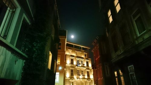 Low angle view of illuminated street light at night