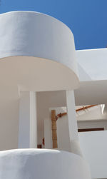 Low angle view of white building against clear sky