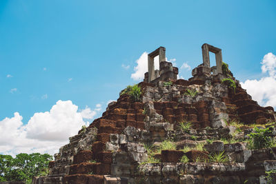 Low angle view of old temple building against sky