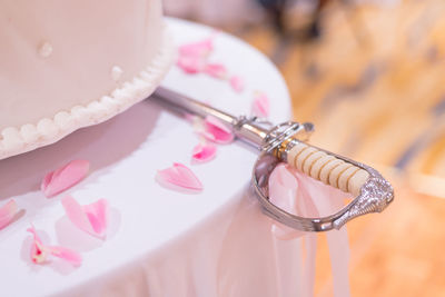 High angle view of pink flower on table