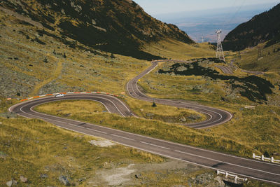 High angle view of road amidst mountains against sky