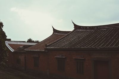 Traditional houses against sky