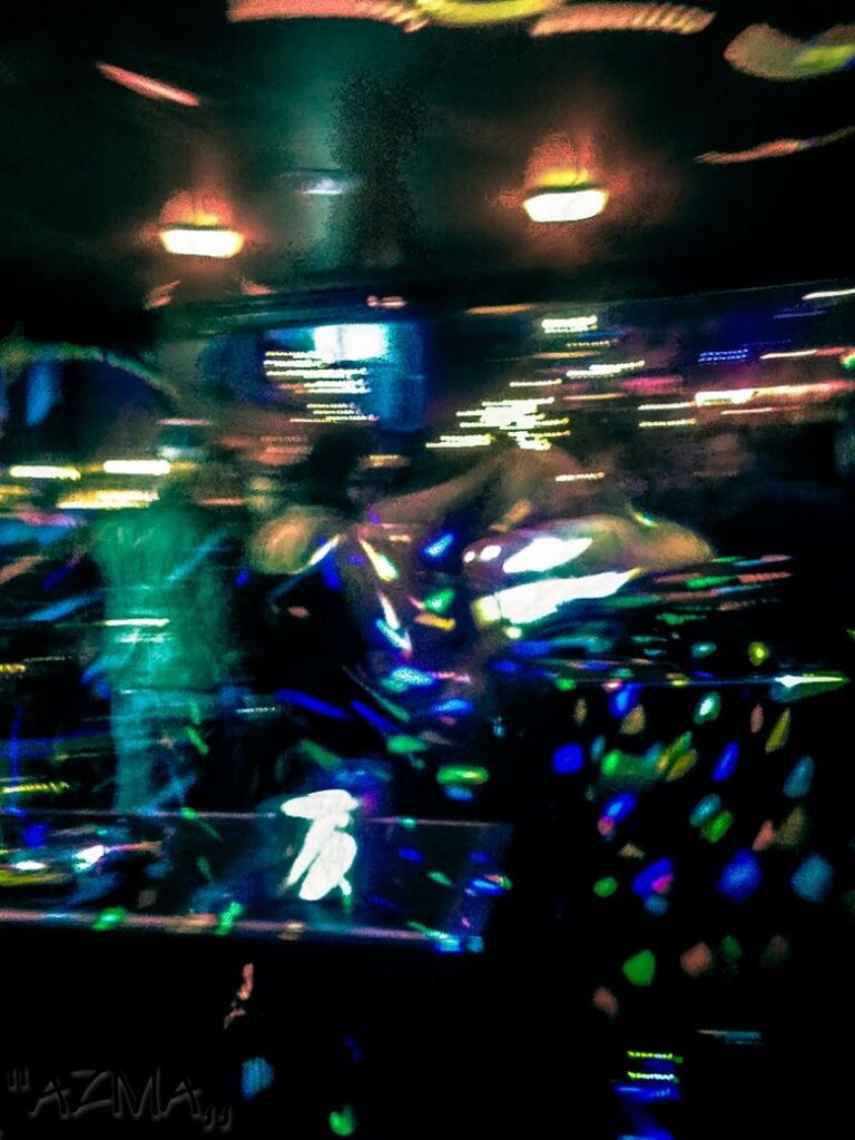 illuminated, indoors, night, lighting equipment, light - natural phenomenon, nightlife, multi colored, reflection, glass - material, dark, light, blue, transparent, glowing, nightclub, electricity, defocused, large group of objects, no people, technology