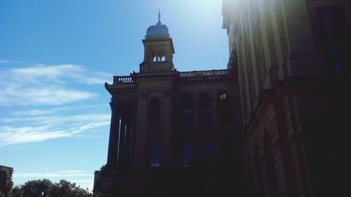 Low angle view of building against blue sky