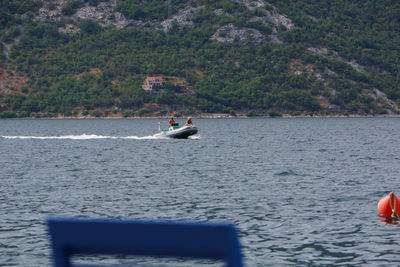 People on boat in sea