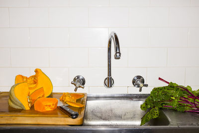 Vegetables by sink in kitchen