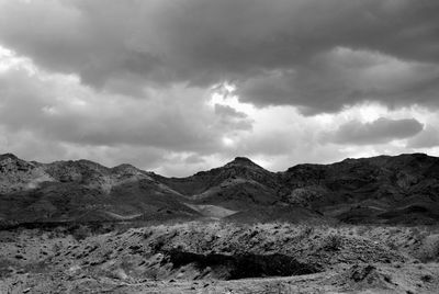 Scenic view of mountains against cloudy sky