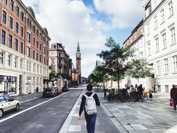 Rear view of man walking in city