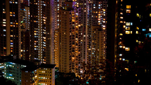 Illuminated modern buildings in city at night