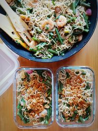 High angle view of noodles in containers on table