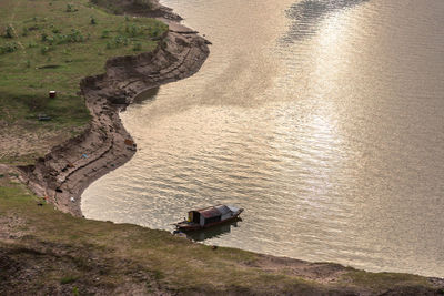 High angle view of man sitting on rock