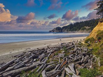 Scenic view of beach against sky during sunset