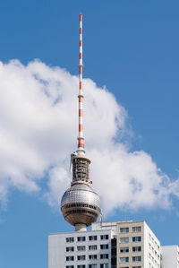 Cityscape of berlin with skyscraper and tv tower against blue sky with clouds