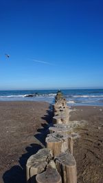 Scenic view of sea against clear blue sky