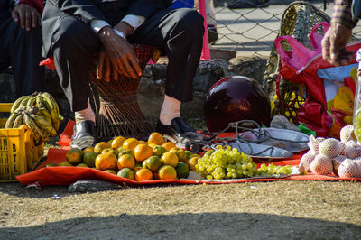 Low section of man selling fruits in market