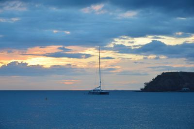 Sailboat in sea against sky