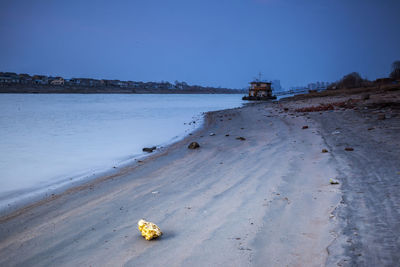 Scenic view of beach against clear sky