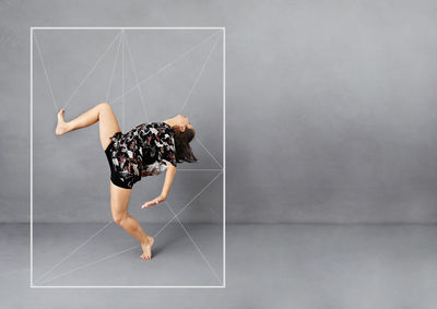 Side view of woman against wall