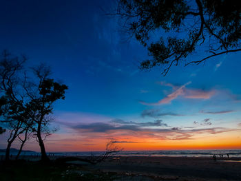 Scenic view of beach against sky during sunset