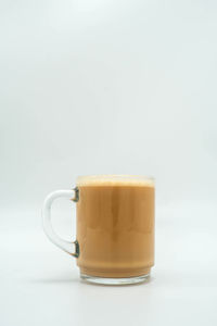 Close-up of coffee cup against white background
