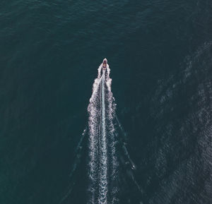 High angle view of ship sailing in sea