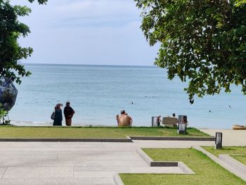 Rear view of people on the sea