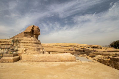 Rock formations on landscape against sky