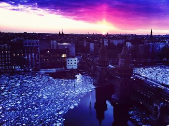 Scenic view of river against cloudy sky