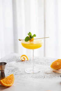 Fresh orange juice in glass on table