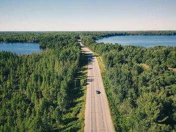 High angle view of road amidst plants against sky