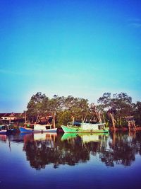 Scenic view of lake against blue sky