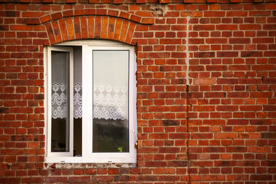 Window on brick wall of building