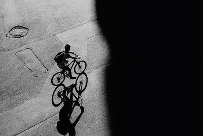 Shadow of people on road