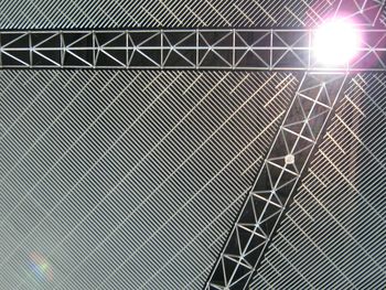 Low angle view of metal structure against sky