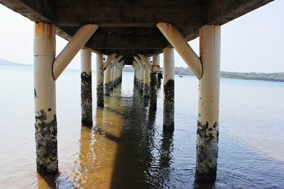 Pier over sea against sky