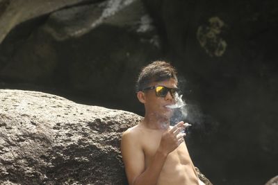 Portrait of young man wearing sunglasses