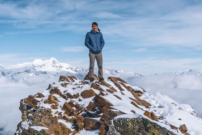 View of man standing on snow covered mountain