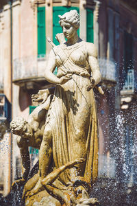 Statue of historic building in city