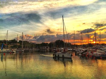 Sailboat in sea at sunset