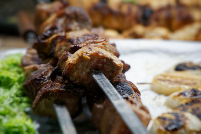Close-up of meat on barbecue grill