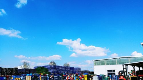 Low angle view of buildings against blue sky