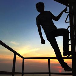 Silhouette of woman at sunset