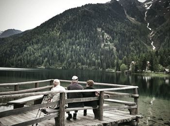 Calm lake with mountains in background
