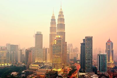 Modern buildings in city against sky